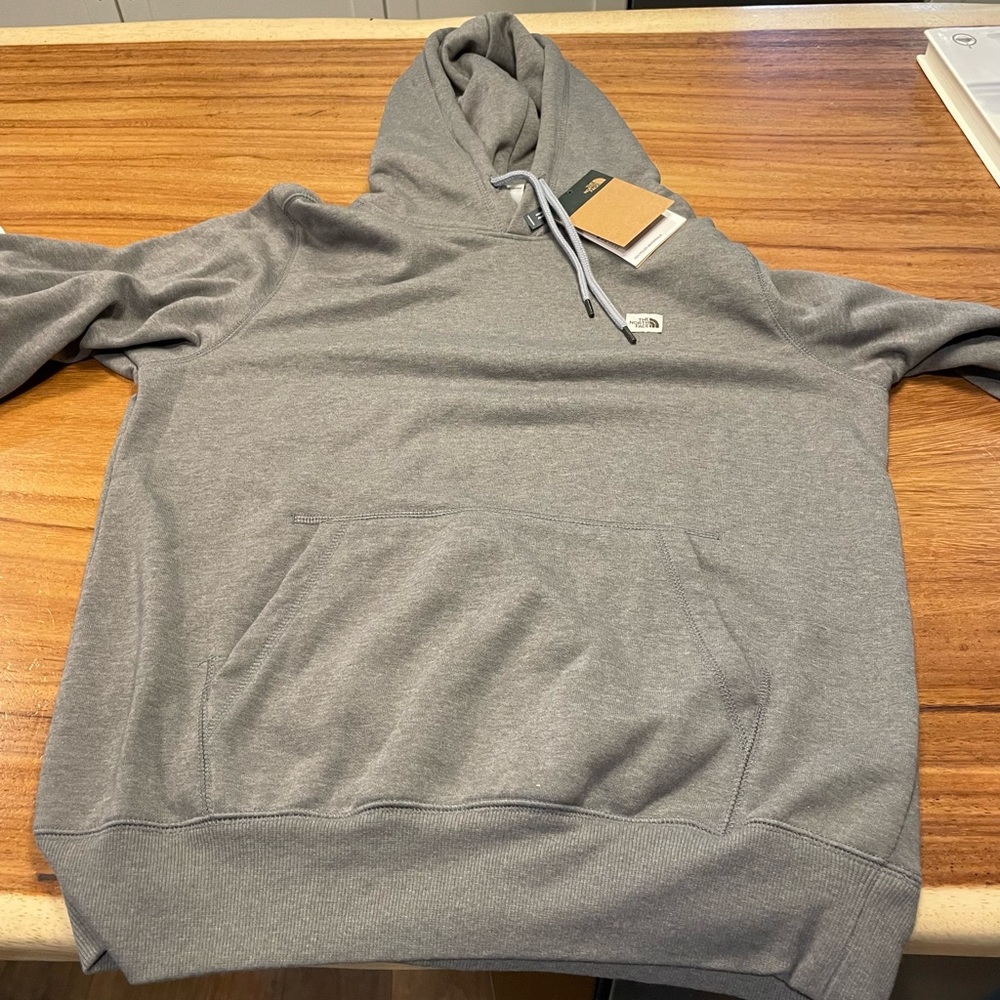 North Face hoodie, never worn, tags on size medium
